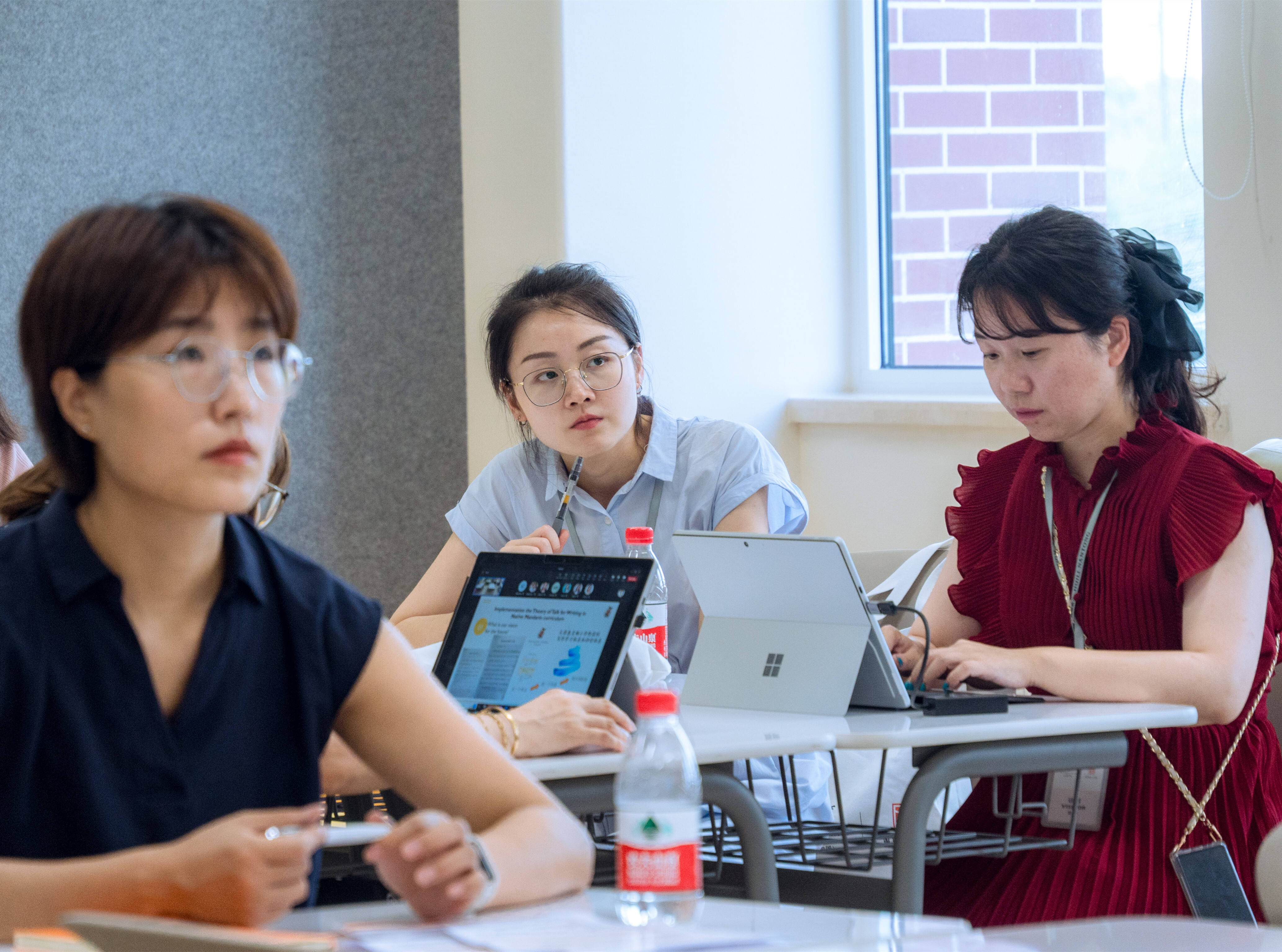 Teachers focus on a sharing in a classroom during a teacher development programme that is part of The Bridge | China initiative by Wellington College China that aims to promote collaboration between schools and international education partnership.