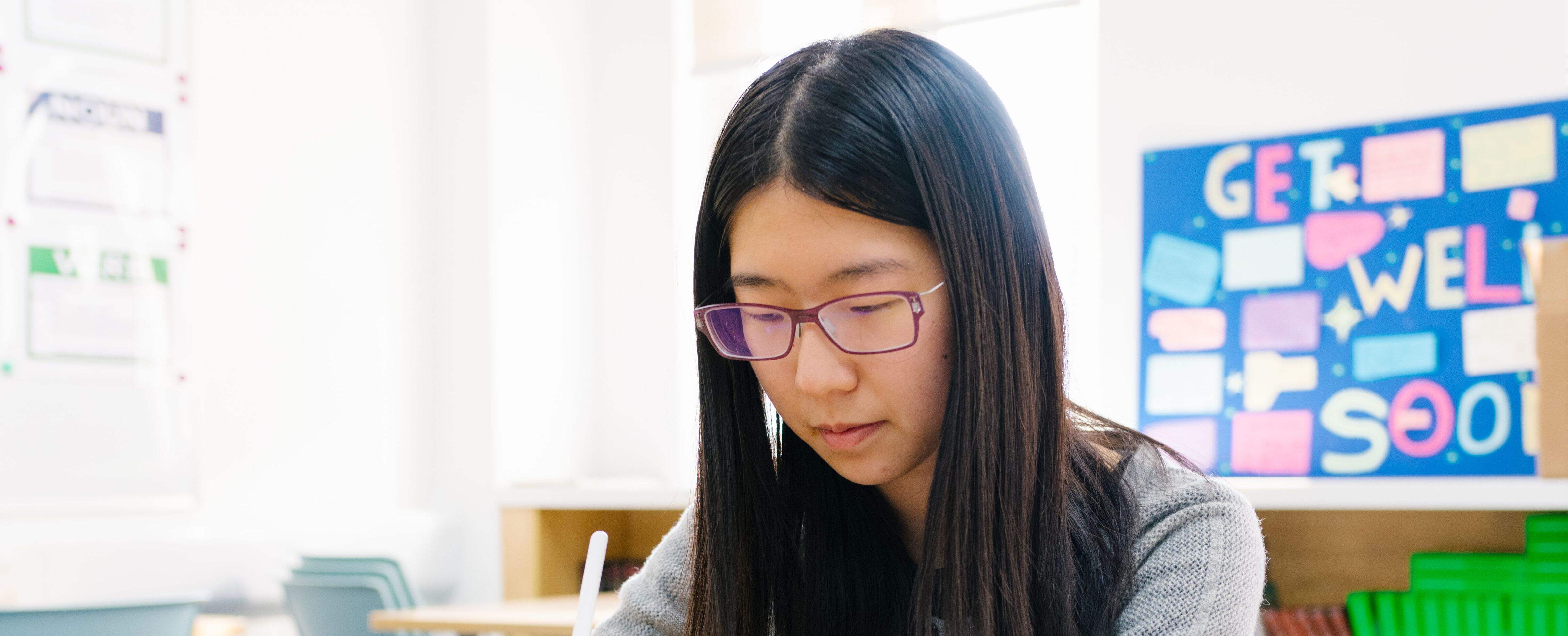 A female applicant takes the admission assessment required to register and apply for a place at Wellington College International Shanghai